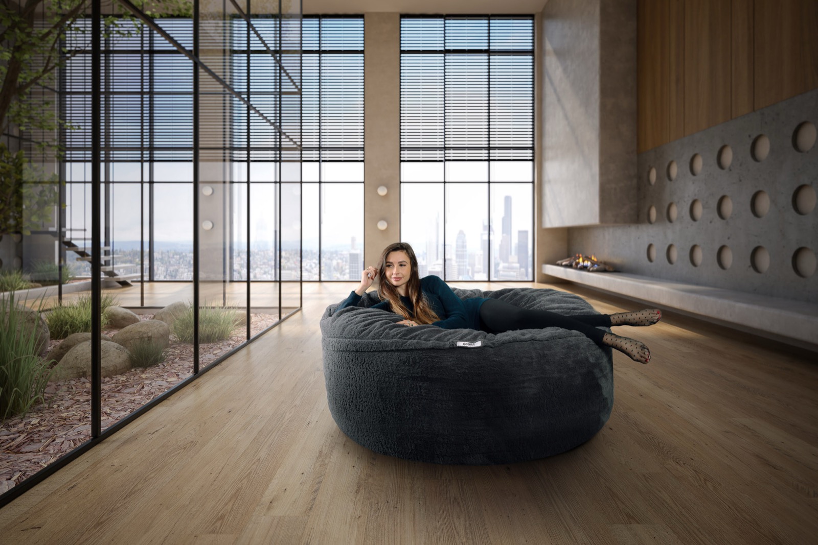 Woman relaxing on The Cosac in a modern penthouse