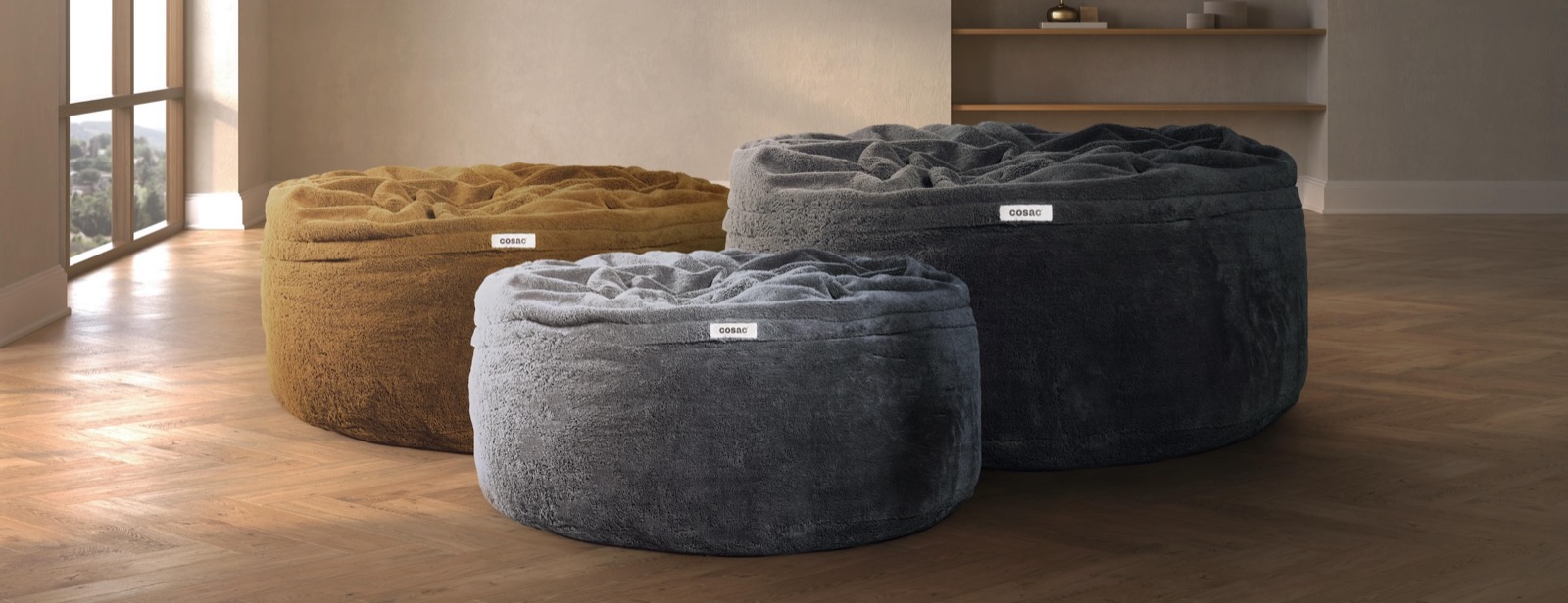 The three Cosac XXL beanbag sizes side by side: 5ft, 6ft, and 7ft in the charcoal colorway